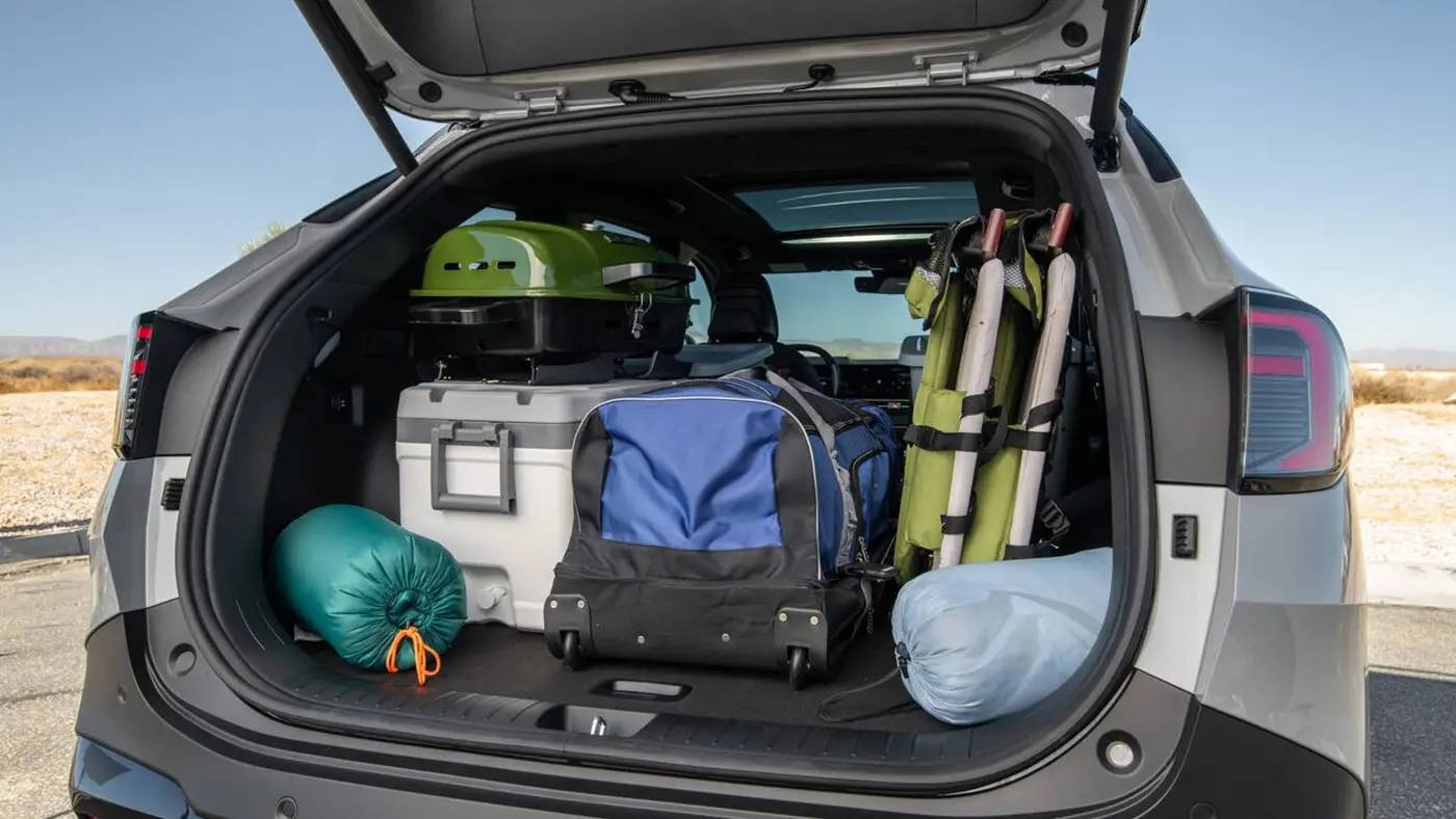 The trunk of a 2026 Kia Sportage filled with bags and gear. 2026 Kia Sportage vs 2025 Kia Sorento at Lally Kia in Chatham, ON