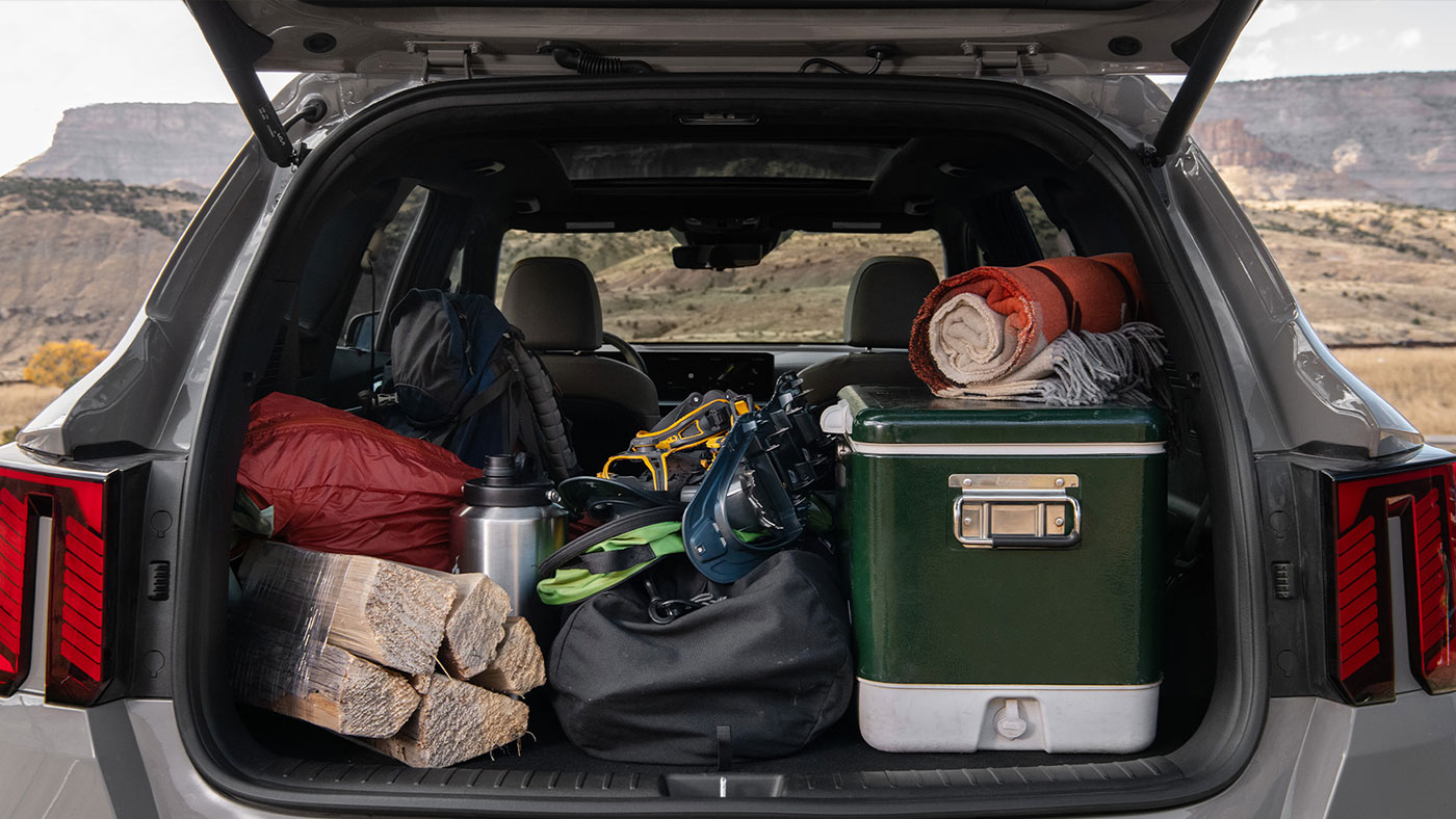 The trunk of a 2025 Kia Sorento filled with bags and gear. 2026 Kia Sportage vs 2025 Kia Sorento at Lally Kia in Chatham, ON